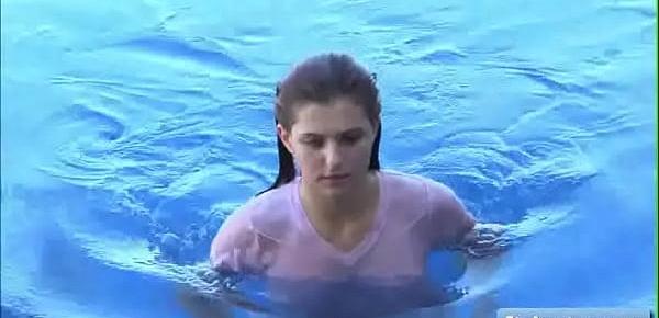  Lovely teen amateur Fiona play with her big natural boobs through her wet t shirt and takes a swim naked in her pool